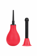 Red squeeze bulb and two black attachments on a white background